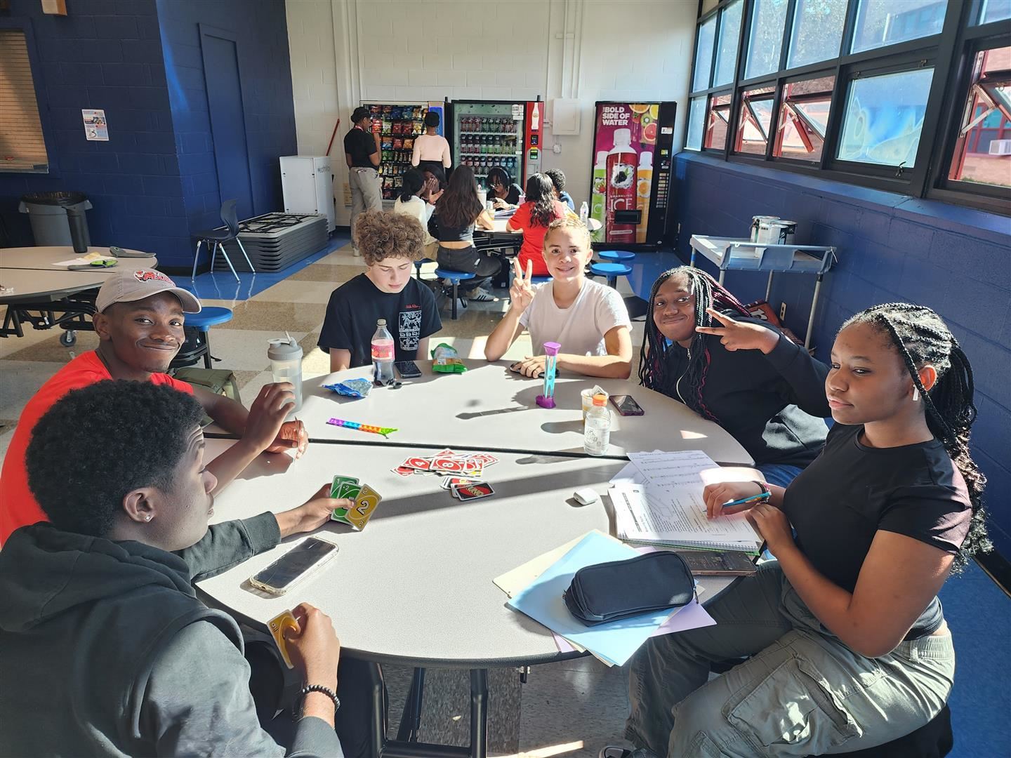  Students meet at a table in the high school senior lounge